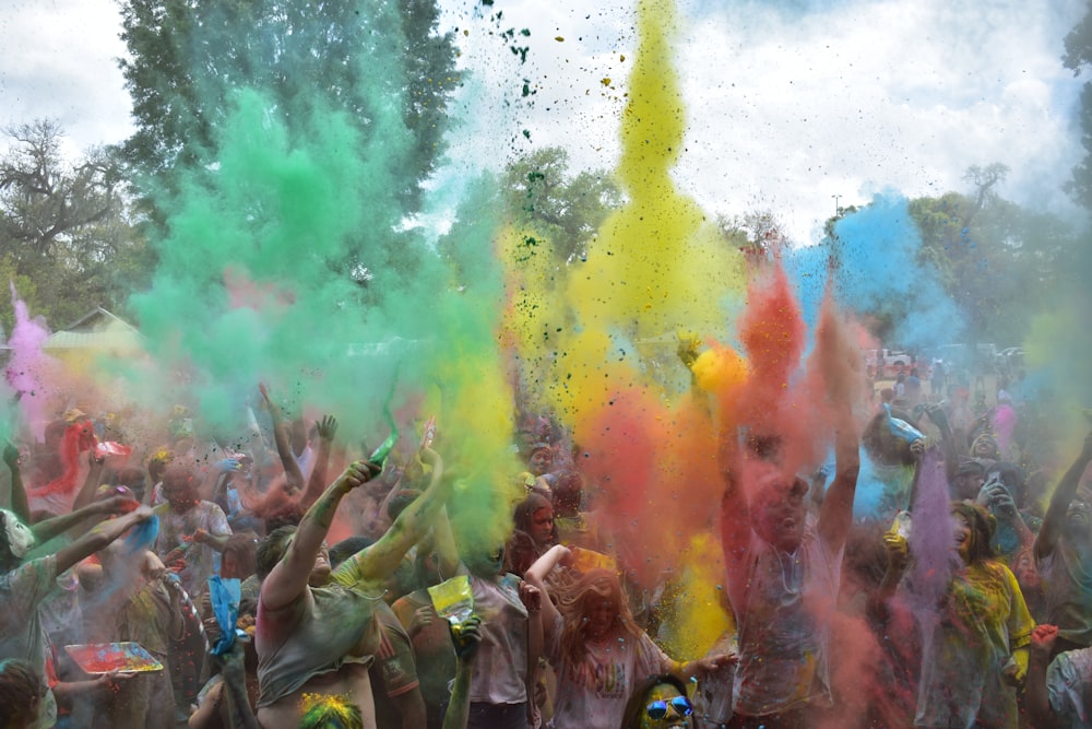 group of people spraying paints during daytime