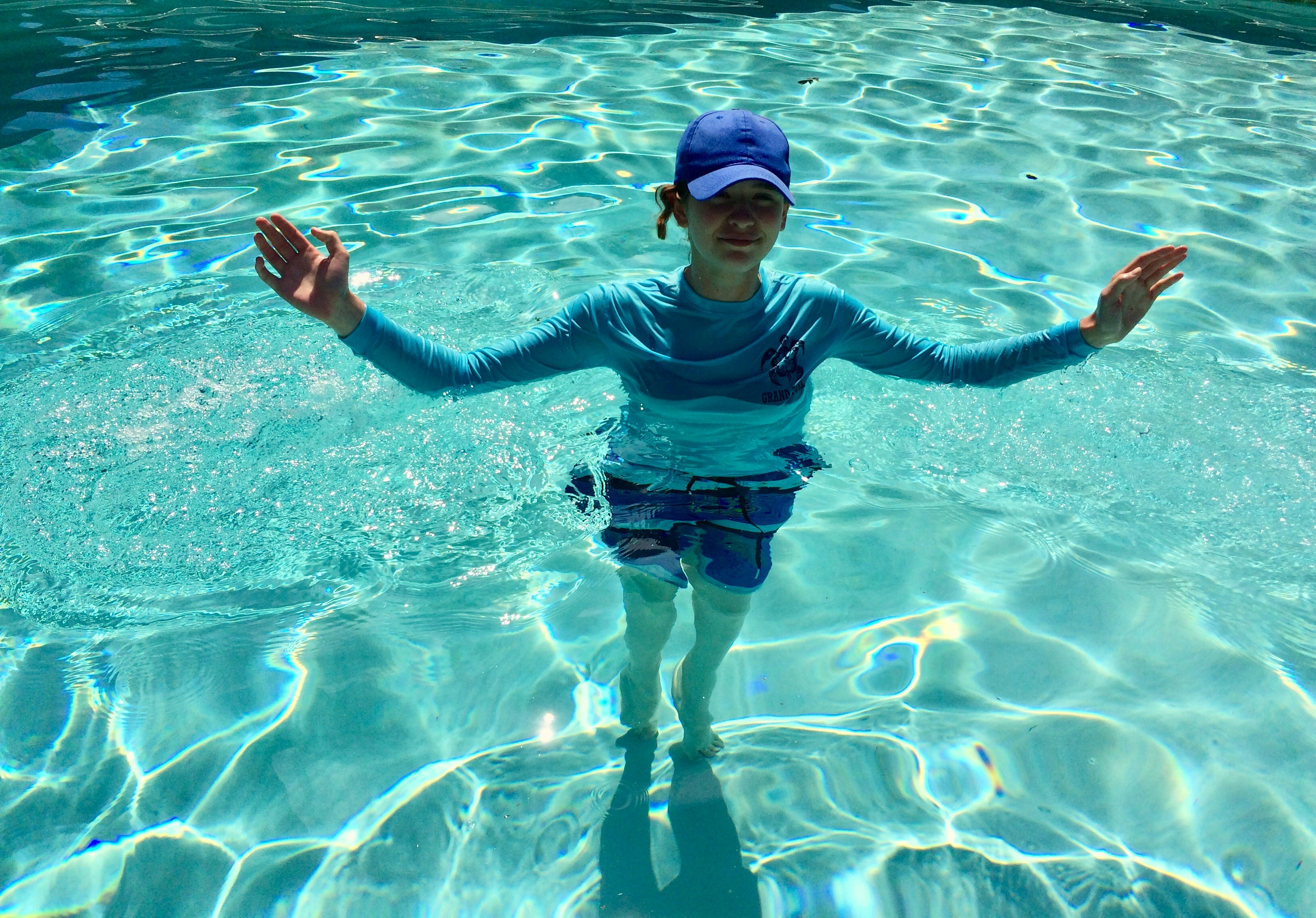 professional pool technician testing water - affordable pool cleaning