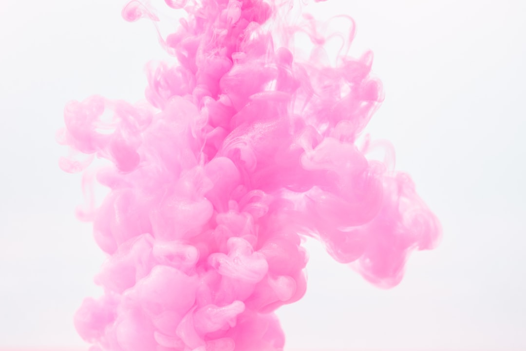 closeup photography of pink liquid