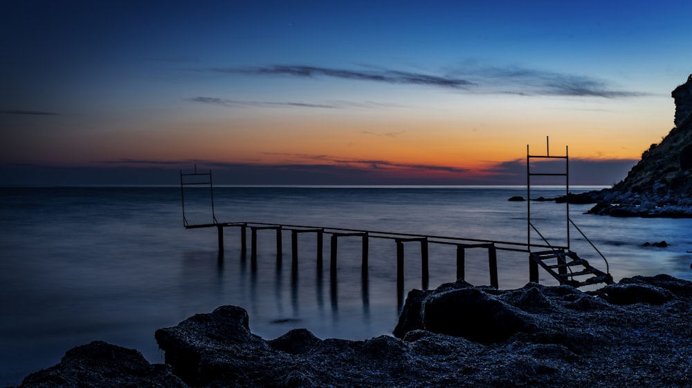 wooden dock on body of water