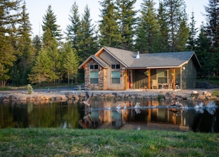 brown house beside body of water