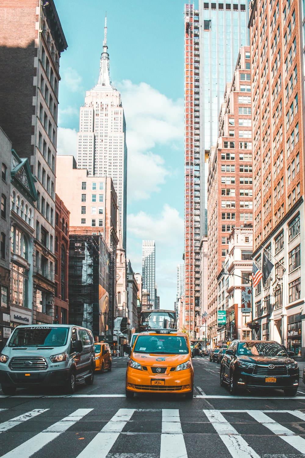 yellow vehicle near building