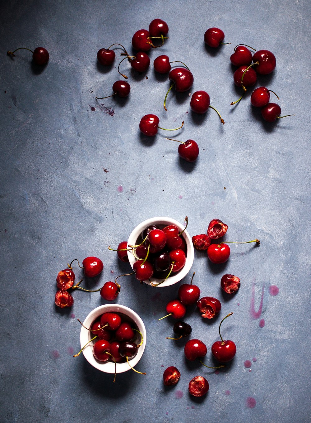 red cherries inside white mug