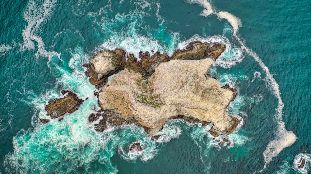 bird's-eye photography of island surrounded by body of waqter