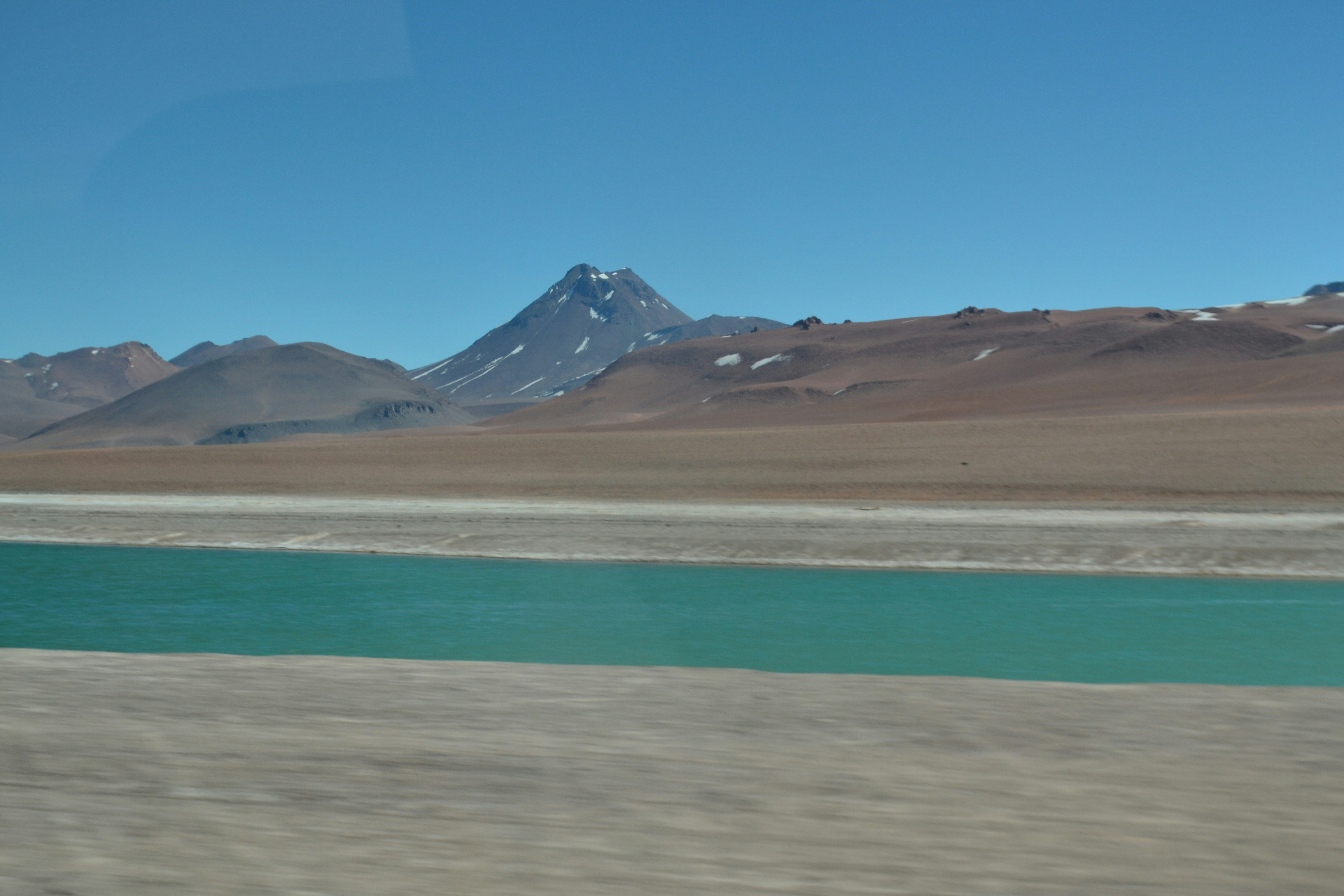 a body of water in the middle of a desert