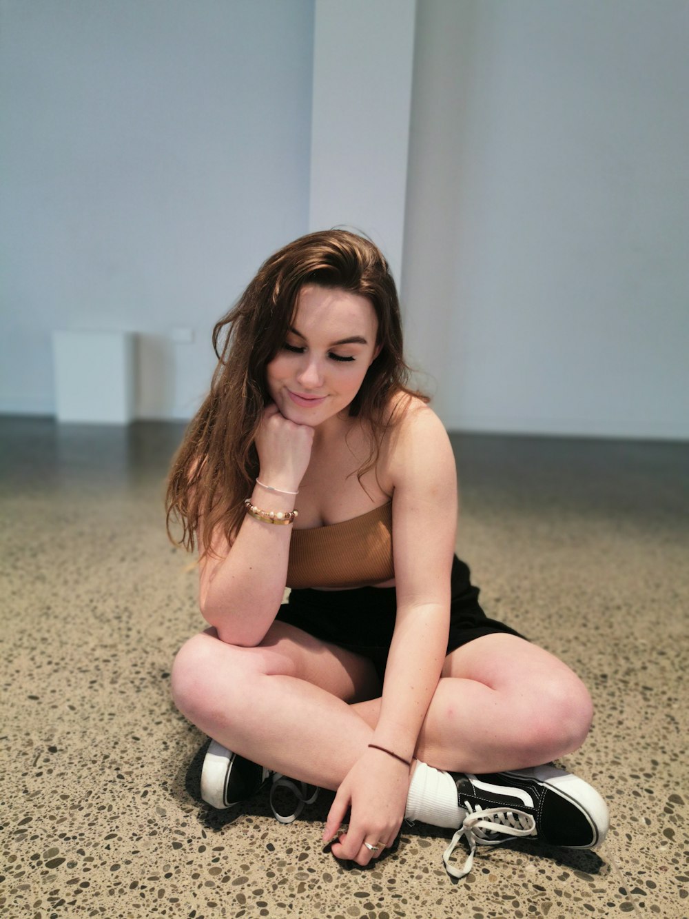 unknown person sitting on floor indoors