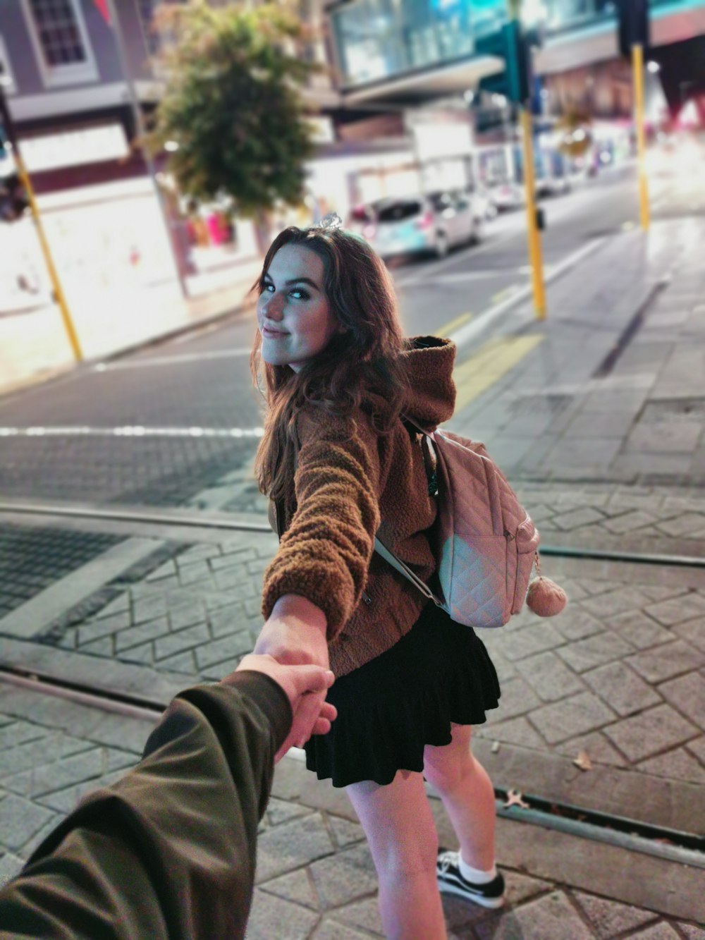 woman standing on concrete ground