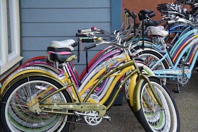 Colorful mini-cruisers lined up on a wooden floor, ready for a casual ride.