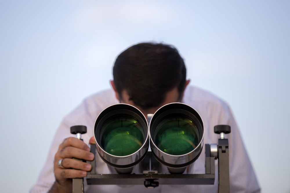 man using green and gray observatory