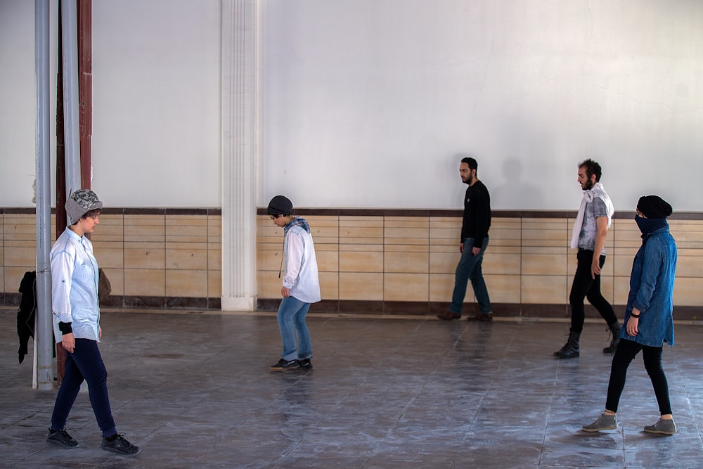 five men dancing at the studio