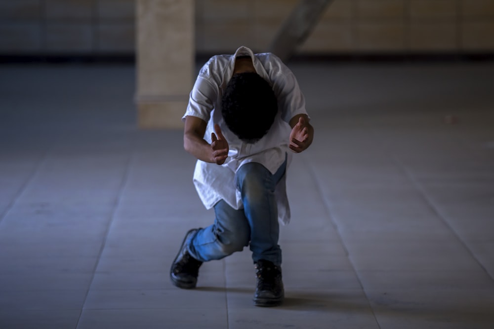 boy dancing on empty room