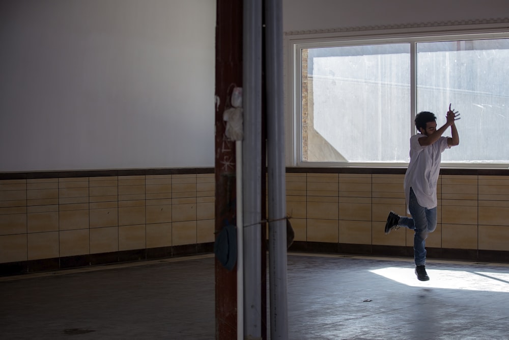 man dancing inside room