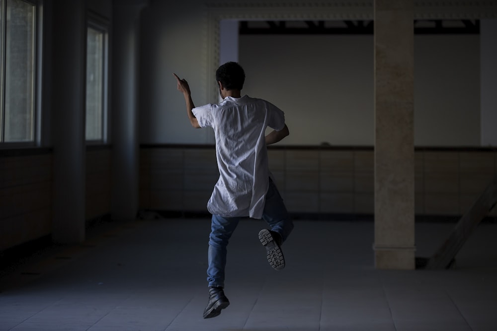 man dancing inside room