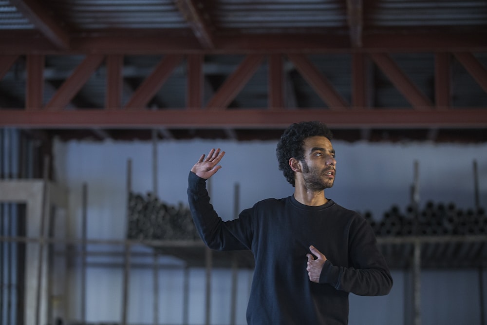 man wearing black sweatshirt