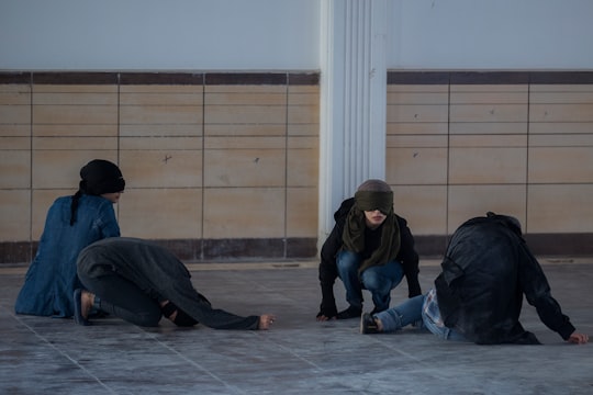 people sitting on ground in Qom Province Iran