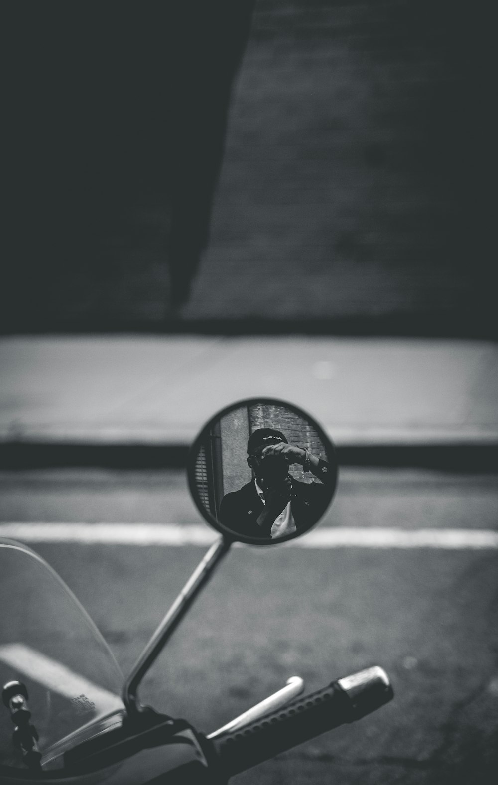 greyscale photography of side mirror