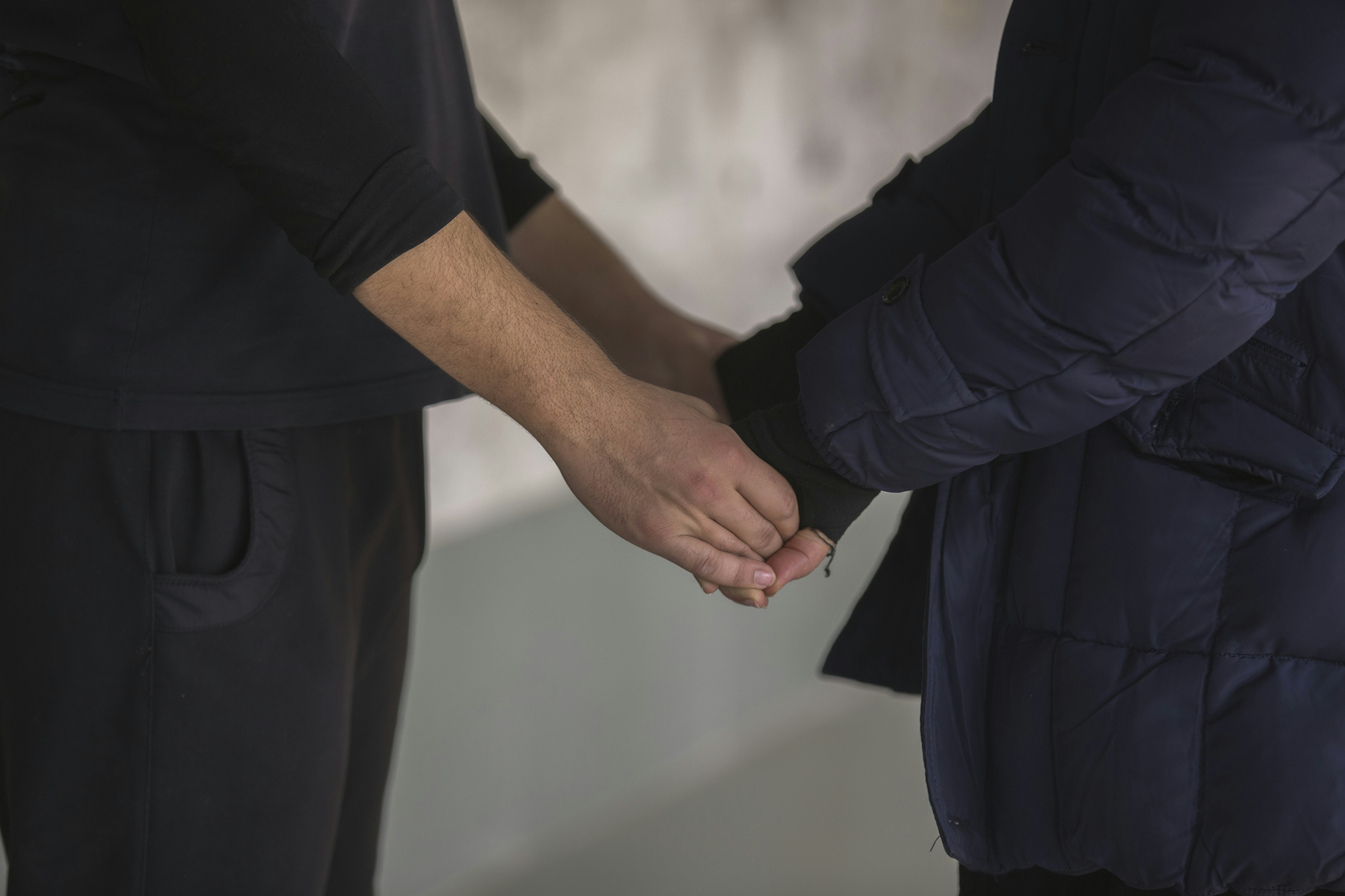 Two people shaking hands in an attorney's office