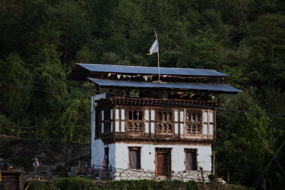 white 2-storey house near trees