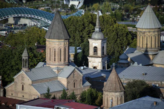 An aerial view showing multiple church buildings linked by glowing pathways symbolizing connection.