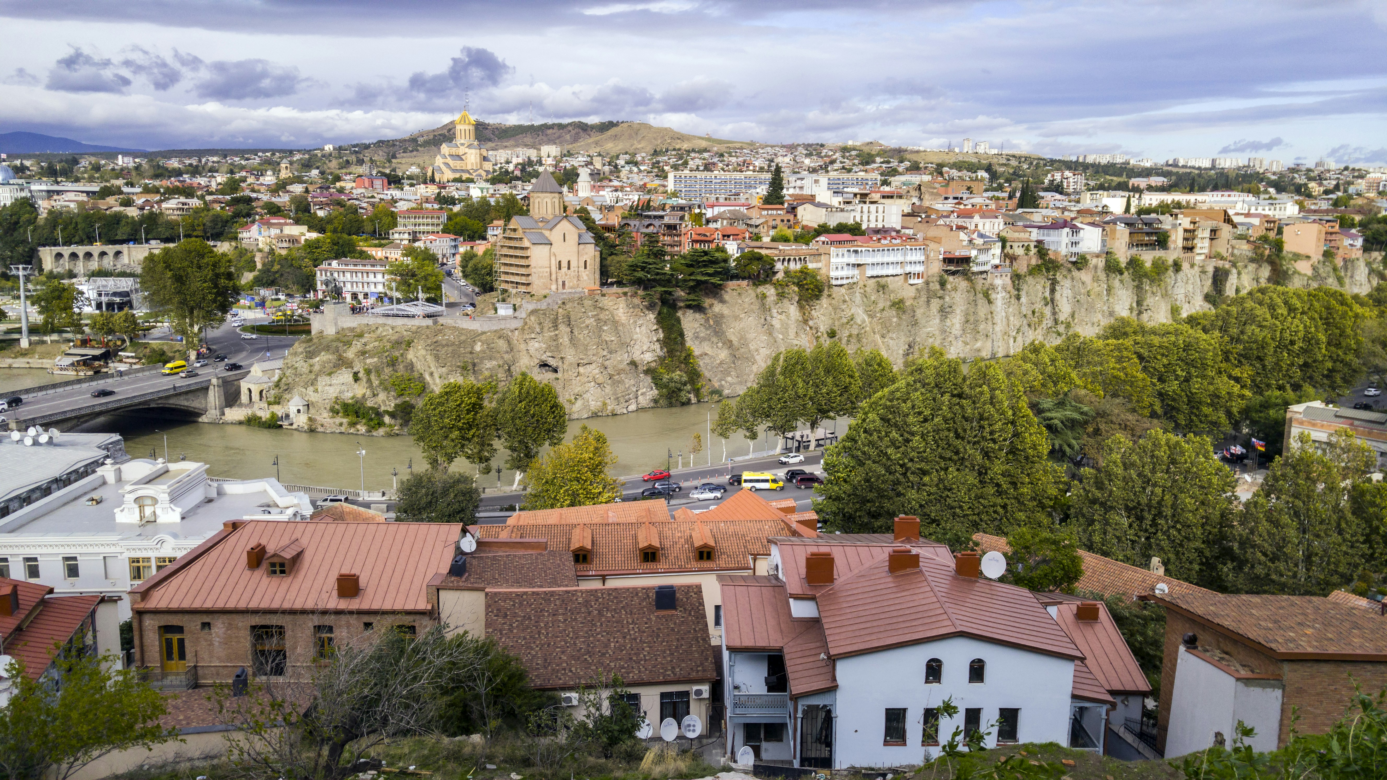 aerial photo of village, Tbilisi in some countries also still known by its pre-1936 international designation Tiflis is the capital and the largest city of Georgia, lying on the banks of the Kura River with a population of approximately 1.5 million people. 