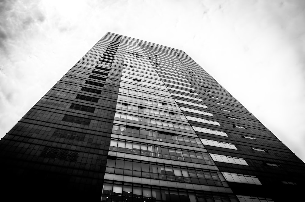 low angle photo of black and gray building