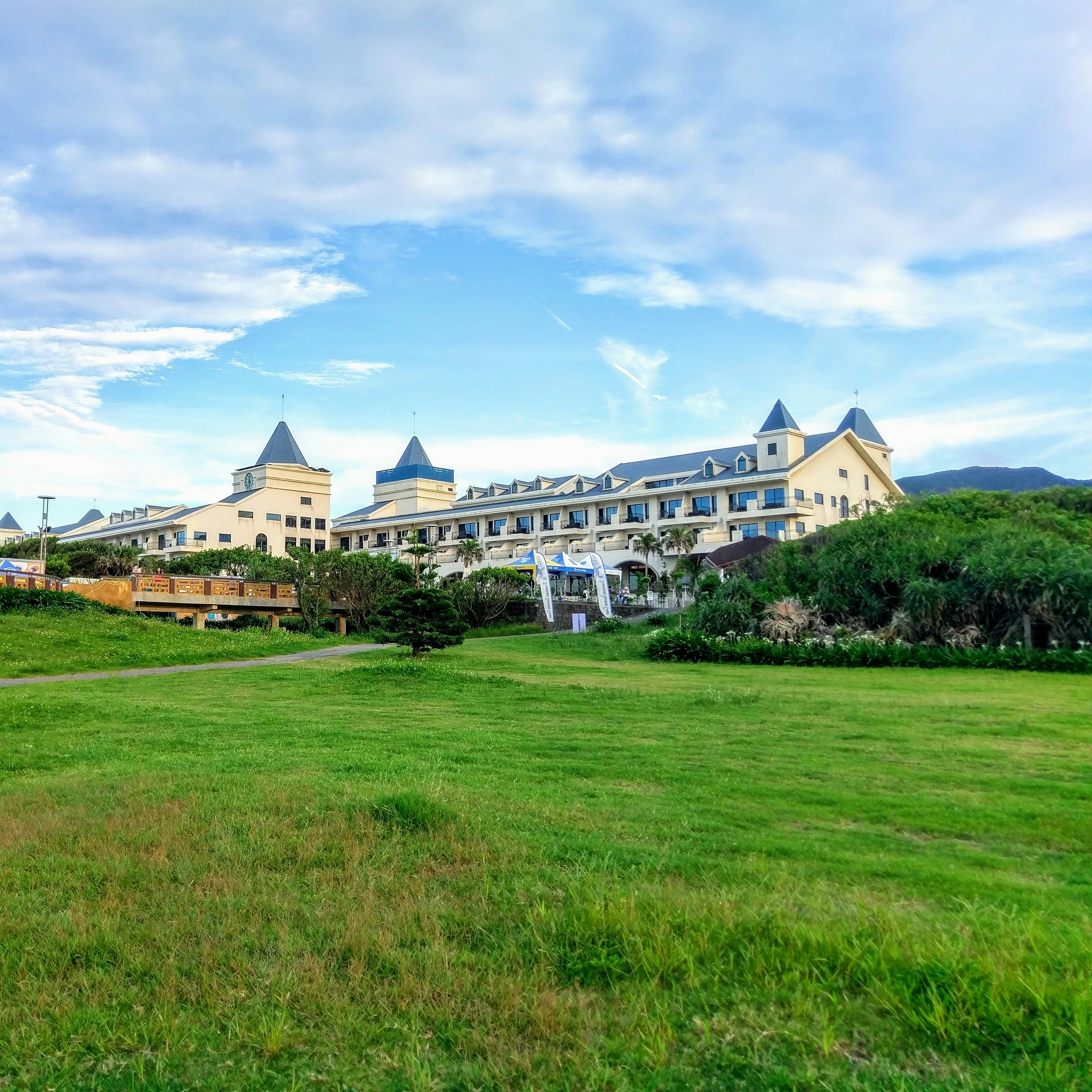blue and white painted building with wide parking area