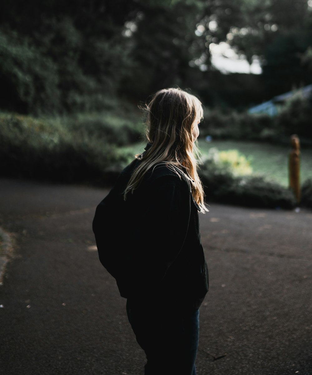 woman standing near plants