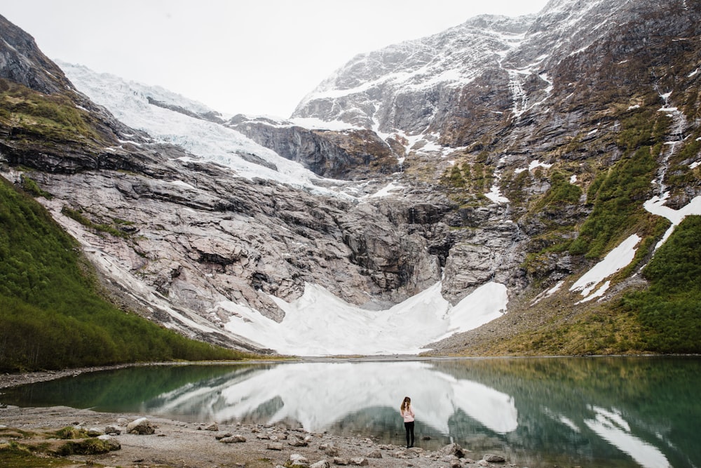 person standing near body of water