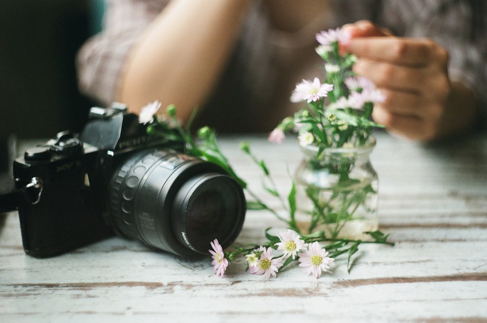 black DSLR camera on table