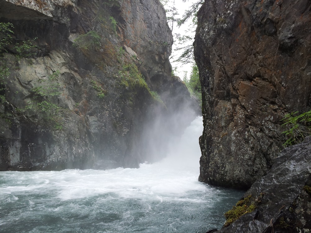 waterfalls between cliffs