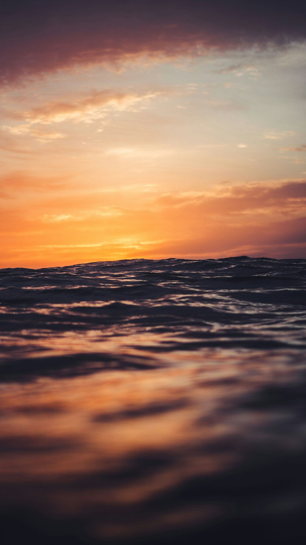 body of water under golden hour