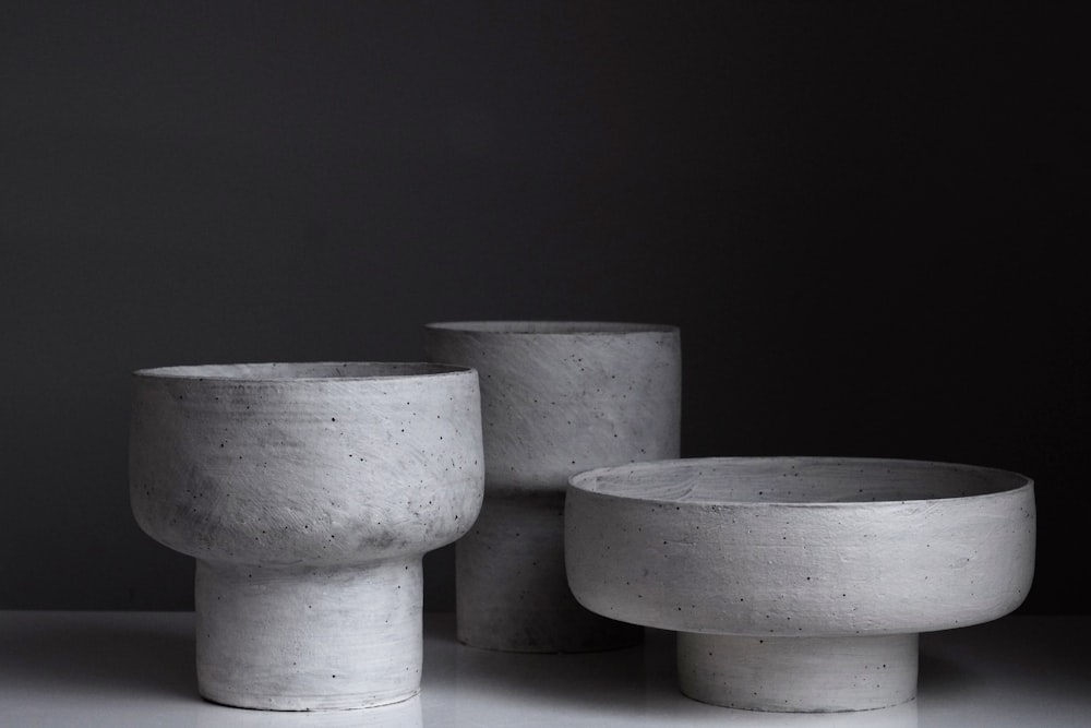 three grey claw bowls