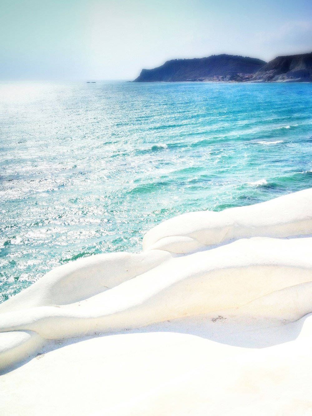 a view of a body of water from a beach