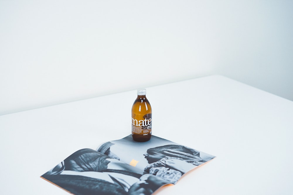 amber glass bottle on gray poster