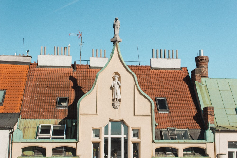 a building with a statue on top of it