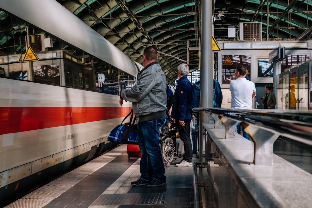 people standing near train