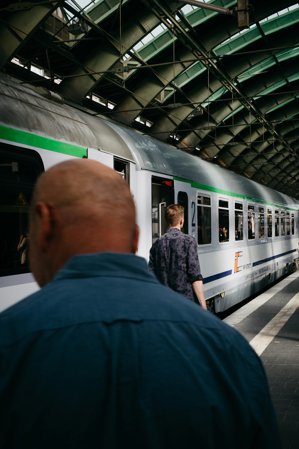 man standing near train