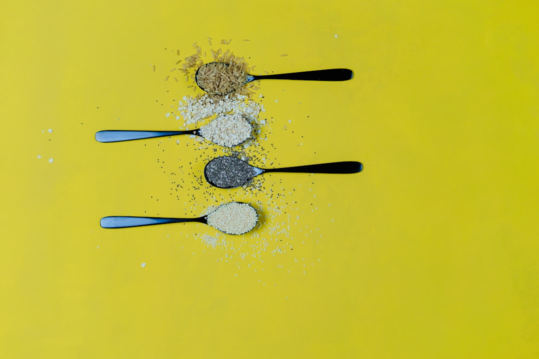 four condiments on spoons