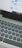 A close-up view of a laptop keyboard and a computer screen displaying the start menu with icons for Internet Explorer and Microsoft Edge, along with a search bar entry point.
