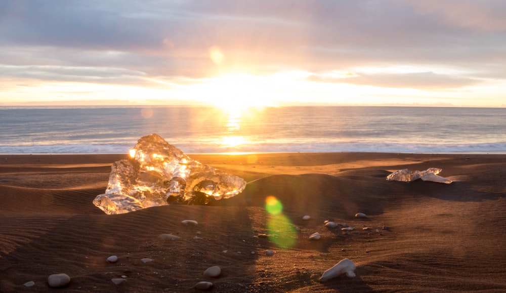 clear stone on sand