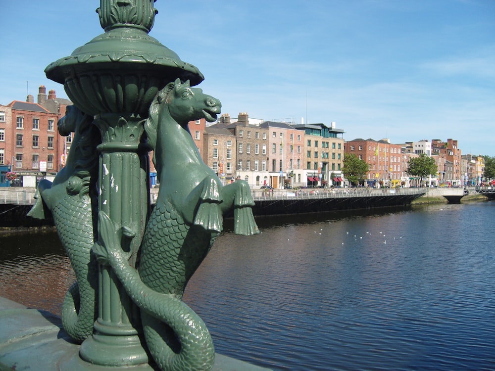 horse statue near body of water