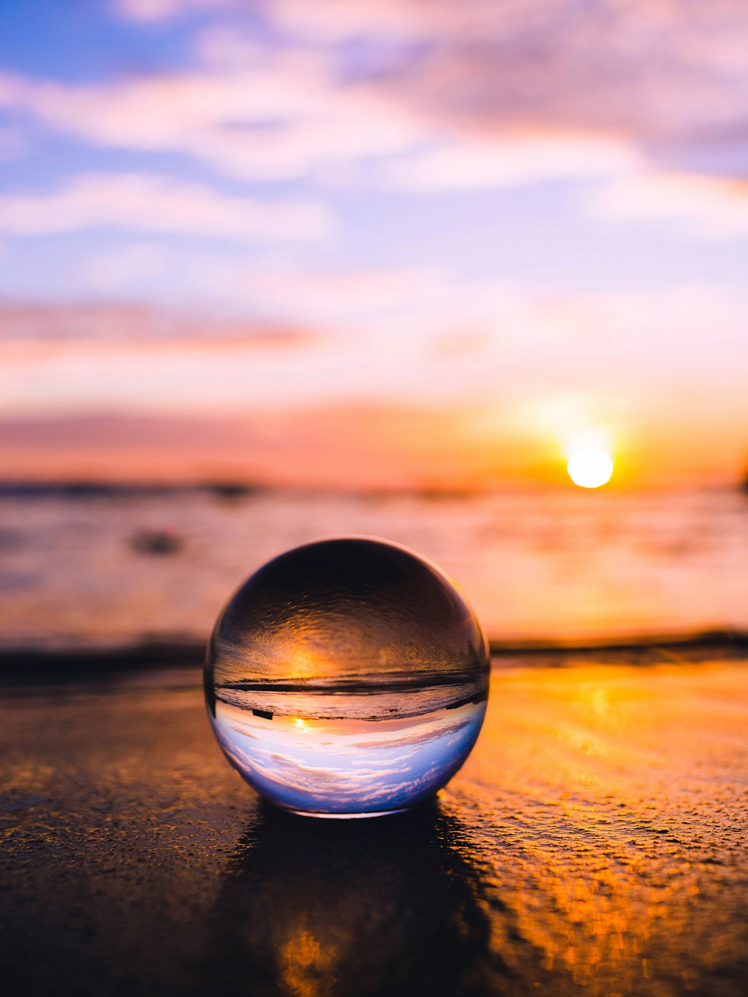 clear crystal ball at sunset