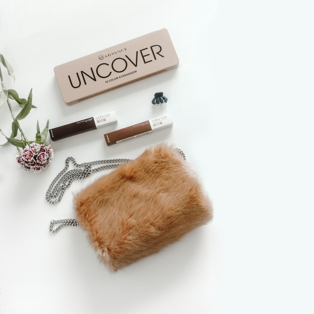 brown Uncover makeup with brown fur pouch