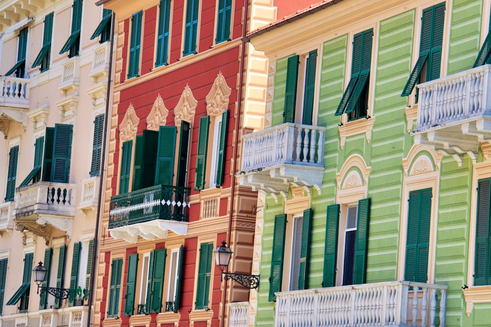 red, green, and beige buildings during daytime