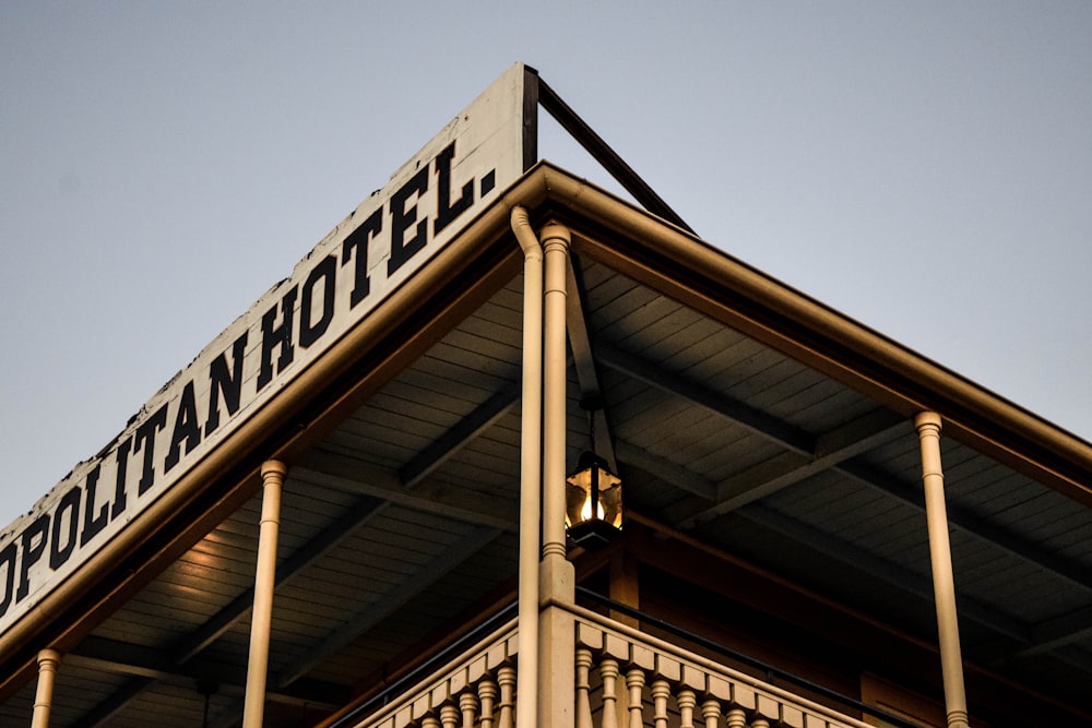 a tall building with a sign on top of it