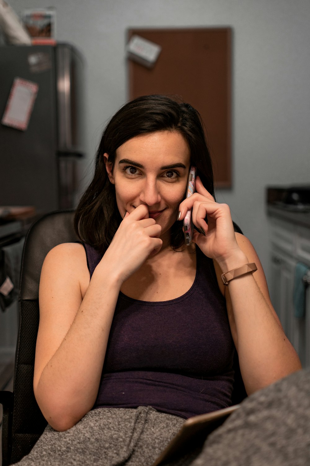 smiling woman talking to phone