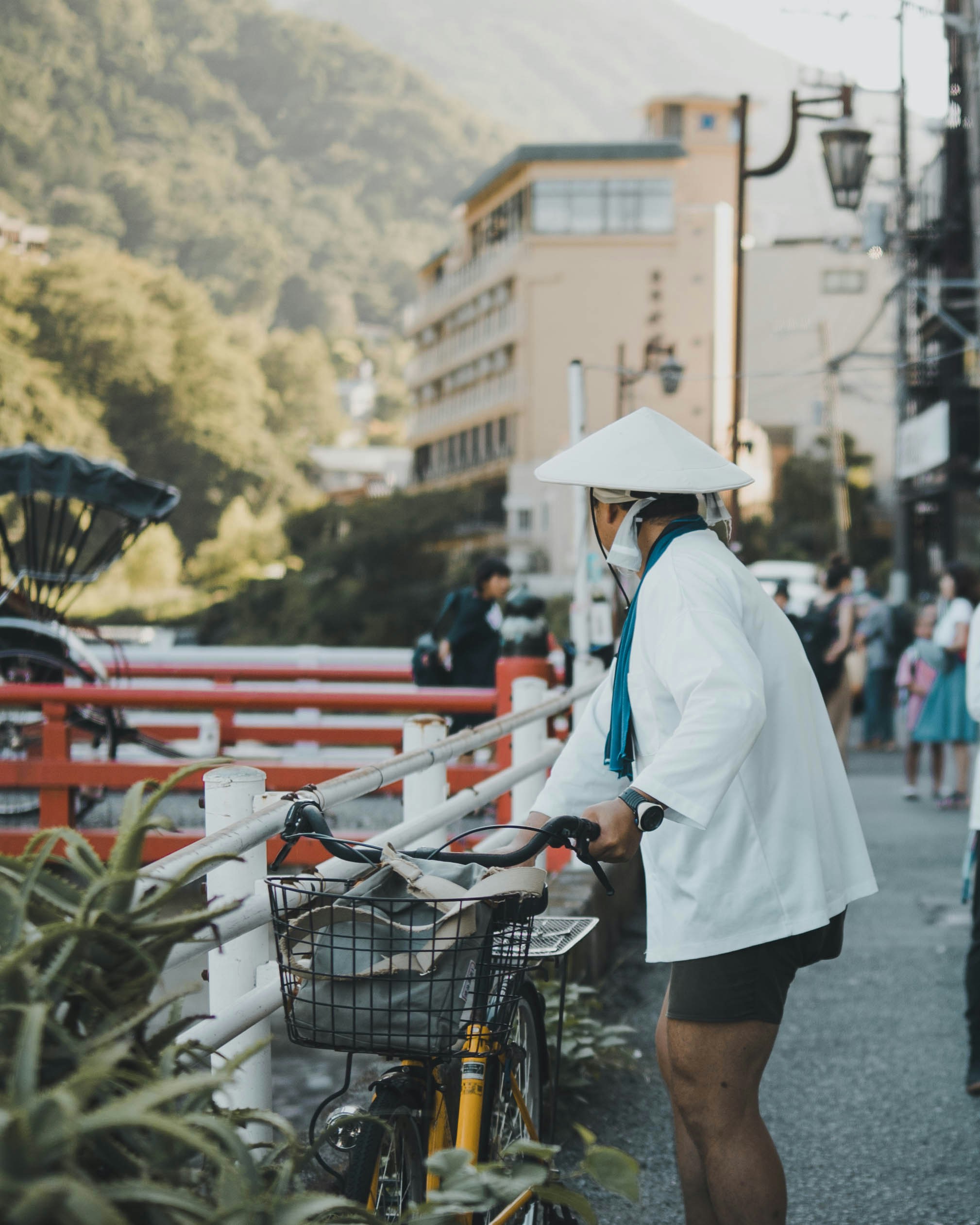 Man Holding Bicycle