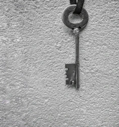 Elegant key hanger mounted on a charcoal grey wall, highlighting its refined craftsmanship.
