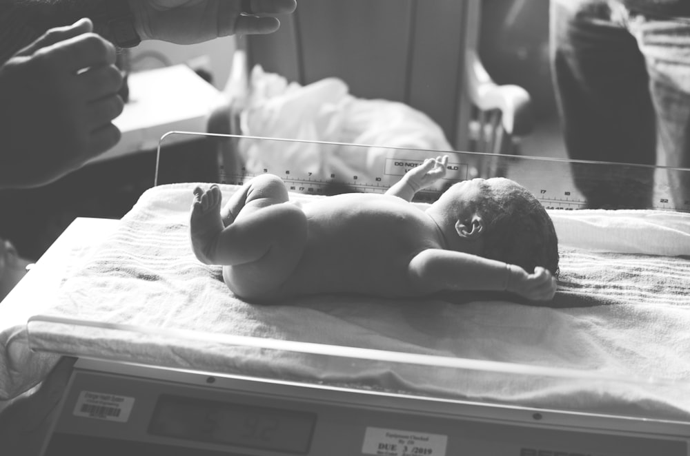 newborn baby on digital scale at 5 and 92