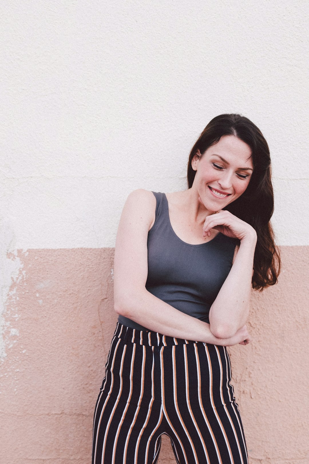 woman standing beside wall